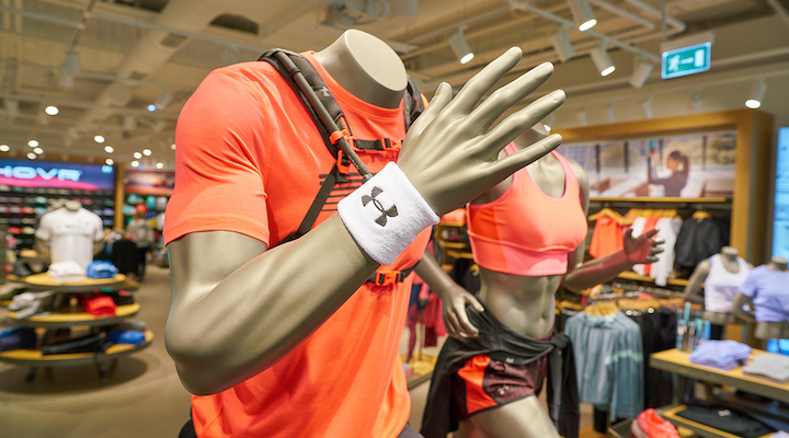 A mannequin wearing Under Armour apparel inside of a store.