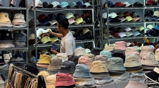 A man shops at Ninh Hiep market, classified by the US Trade Representative among "notorious markets" for counterfeiting