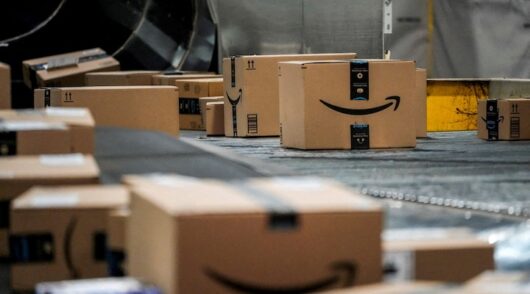 An Amazon box moves along a conveyor belt at Amazon's fulfillment center