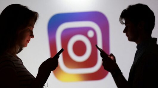 Instagram logo and smartphone users.