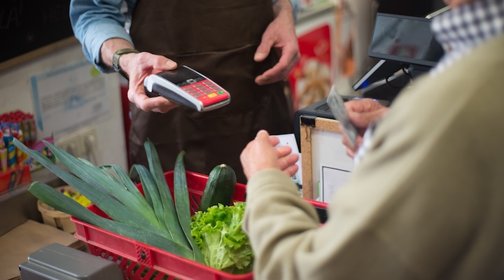 A shopper making a card purchase