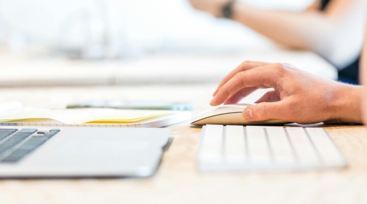 Hand using a computer mouse.