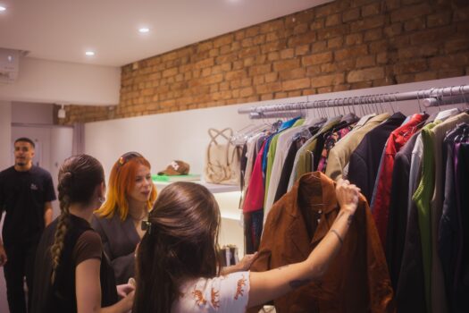Shoppers browsing second-hand fashion.