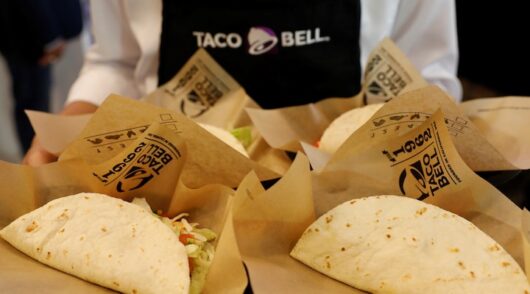 A server holds food during the opening ceremony of a Taco Bell restaurant in Bangkok