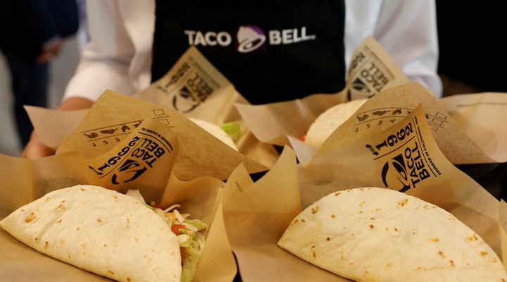 A server holds food during the opening ceremony of a Taco Bell restaurant in Bangkok