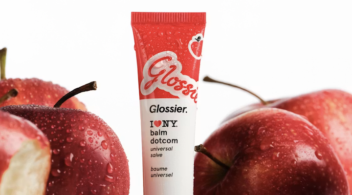 An apple-themed Glossier Balm Dotcom product.