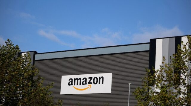 Amazon logo outside an Amazon warehouse in Manchester