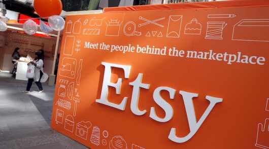 A sign advertising the online seller Etsy