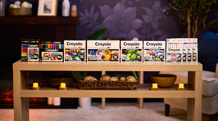 Several items from Crayola’s All Grown Up collection laid out on a table.