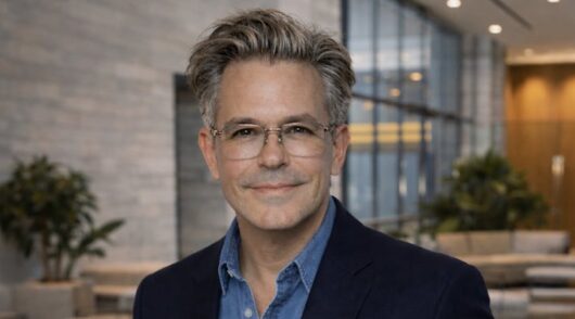 Old Navy CEO Michael Francis in a conference room setting.