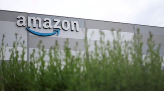 The logo of Amazon is pictured at a company logistics center