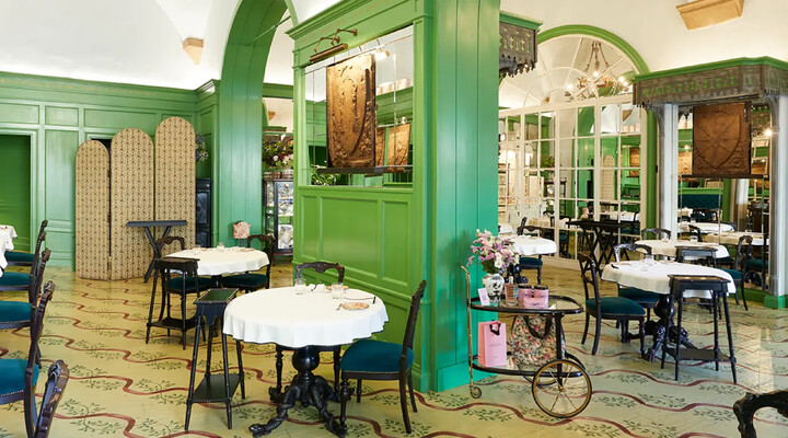 Gucci Osteria’s green dining room.