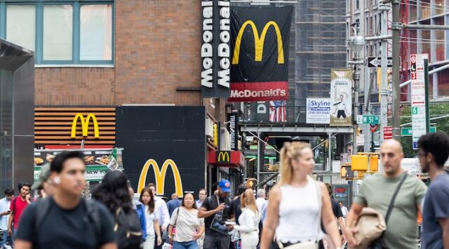 People walk by a McDonald's in New York City