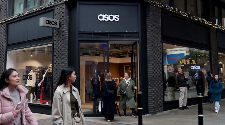 People walk past the Asos pop-up store in London