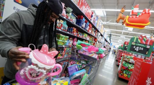 A customer shops for toys for holiday gifts at a Walmart Supercenter retail store in North Bergen